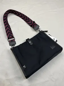 Threebox black nylon crossbody bag for men with stylish pink chevron strap and zipper.