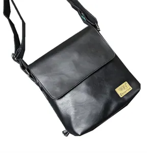 Mens black leather messenger bag, vertical cross body shoulder bag for daily casual commute.