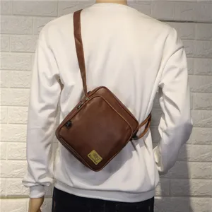 Men's brown vertical crossbody bag, casual outdoor fashion shoulder bag for daily use.