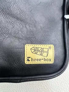 Close-up of Three-box casual black leather crossbody bag, stylish daily shoulder bag.