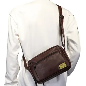 Men casual brown leather messenger bag with adjustable strap and front zipper pocket for use.