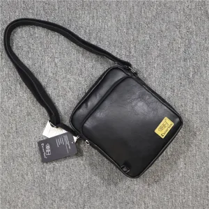 Men's black PU leather vertical shoulder bag casual crossbody bag with zipper and adjustable strap.