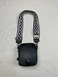 Mens black vertical crossbody bag with black white wide strap casual shoulder bag