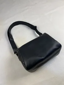 Casual black crossbody bag for daily commute and travel, minimalist design style