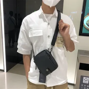 Threebox black vertical PU leather crossbody bag for men and women, casual Japanese style.