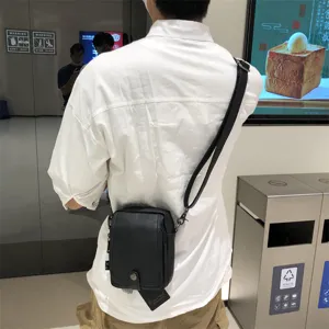 Black vertical PU leather crossbody bag for men, casual Japanese style shoulder bag with adjustable strap.
