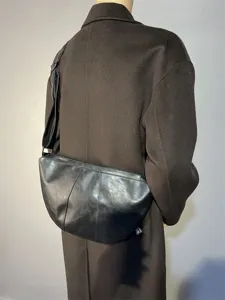 Details of this vintage black crescent crossbody bag, perfect for daily commuting and cycling.