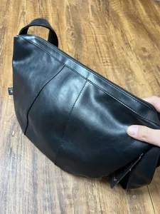 Men's black PU leather crescent crossbody bag, vintage dumpling shoulder bag for daily commute.