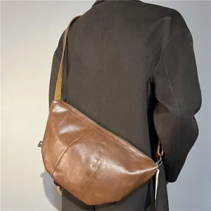Retro brown PU leather dumpling crossbody bag, stylish crescent shoulder bag for men and women