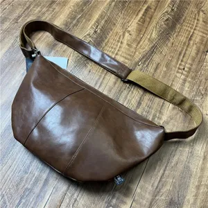 Vintage brown faux leather dumpling crossbody bag for men and women, casual daily commute.