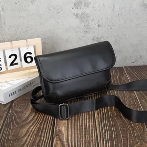 Men black soft leather cross-body shoulder bag with adjustable strap and flap detail.
