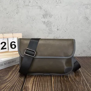 Detail close-up view of olive green retro messenger bag, casual soft leather bag.