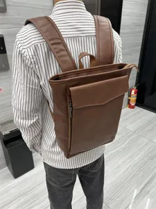 Brown leather backpack for men and women, stylish daily school bag and travel daypack.