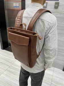 Vintage brown PU leather backpack for men, casual student school bookbag and travel daypack bag.