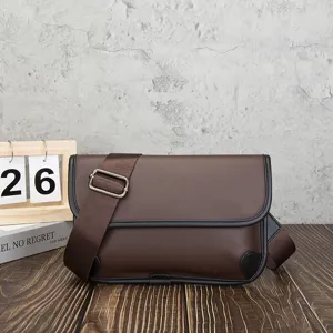 Close-up of brown vintage soft leather crossbody bag with black trim and adjustable strap.