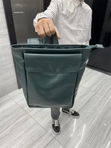 Dark green PU leather backpack for men, stylish Japanese student school bag and laptop travel daypack.