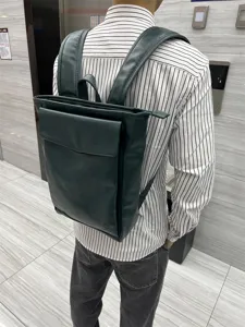 Dark green leather backpack for men and women, casual school travel laptop daypack stylish.