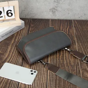 Detailed view of the vintage men soft leather messenger bag showing texture, strap and finish.