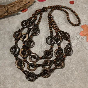 Handmade wooden bead coconut shell multi-layer long necklace bohemian resort jewelry detail.
