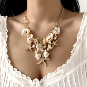 Gorgeous bohemian seashell and starfish statement necklace detail shot for beach vacation.