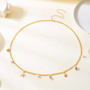 Bohemian gold metal chain necklace with pearls starfish and shell charms for beach vacation.