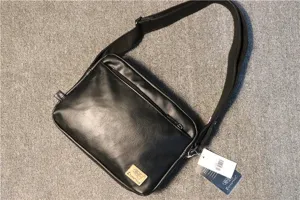 Black PU leather messenger bag for men, minimalist outdoor crossbody bag with zipper pocket.