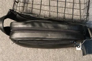 Men's black PU leather shoulder bag detail, top zipper closure, daily casual crossbody bag.