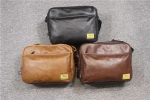 Detailed view of three casual PU leather messenger bags in black, brown and khaki colors.