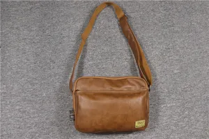 Brown leather texture crossbody bag with adjustable strap and front zip pocket for casual daily use.