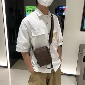Men soft leather vertical crossbody bag casual brown messenger shoulder bag for daily travel.
