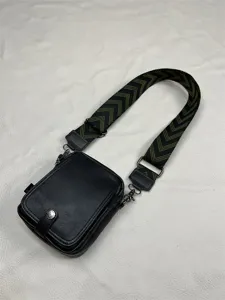 Men black crossbody bag detail, wide chevron strap small square shoulder bag for outdoor use.