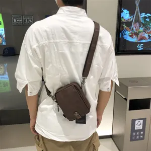 Men casual soft leather vertical crossbody bag detail view showing daily wearing style.