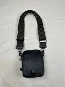 Men's vertical crossbody bag with wide chevron strap, minimalist black daily messenger bag.