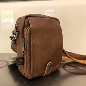 Threebox casual brown soft leather vertical crossbody shoulder bag detail, with flap.