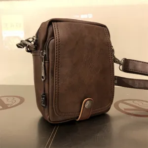 Threebox brown soft leather vertical crossbody bag, casual men shoulder bag detail view.
