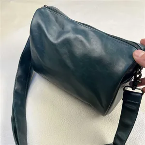 Dark green casual shoulder bag for men and women, stylish commuter daily crossbody bag.