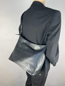 Detailed view of black PU leather men shoulder bag, casual large capacity crossbody tote.