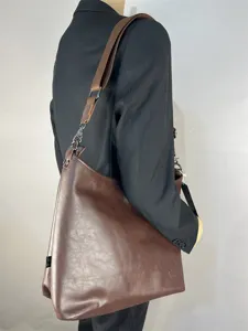 Brown leather shoulder bag for men, casual large capacity tote and messenger bag style.