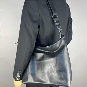 Stylish men's black leather shoulder bag large capacity casual crossbody tote bag.
