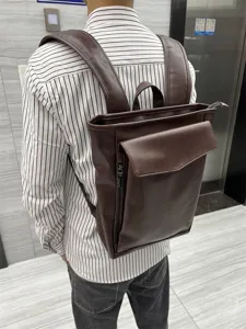 Detailed view of dark brown leather backpack, casual daily school and outdoor travel bag.