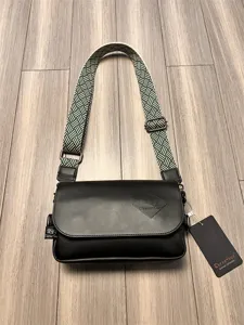 Stylish black men's casual crossbody bag with unique woven wide strap for daily use and travel.