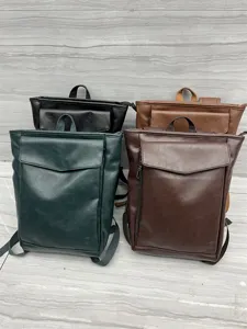 Detailed view of casual PU leather backpack featuring front flap pocket and sturdy shoulder straps.