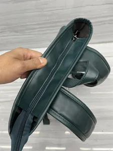 Dark green leather casual backpack for men and women, stylish daily school bookbag.