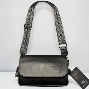 Men's black PU leather crossbody bag with wide geometric pattern strap casual messenger bag.