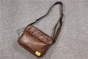 Brown leather messenger bag for men and women, vintage casual crossbody bag with adjustable strap.