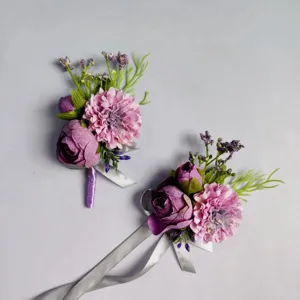 Close-up detail of purple artificial flower boutonniere with silver ribbon for wedding groom suit.
