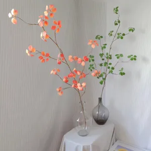Artificial branch leaf decor, beautiful home soft decoration floral arrangement detail shot.