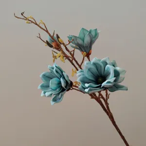 Close up detail of blue artificial magnolia flower branch with realistic EVA petals.