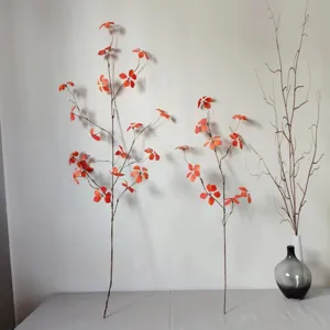 Artificial orange leaf branch for home decor, minimalist floral arrangement stem for vase.