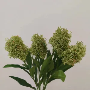 Artificial green skimmia berry flower branch detail, premium silk floral home decor.